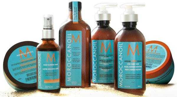 Moroccanoil hair products assortment, including oil, shampoo, conditioner, and styling cream.